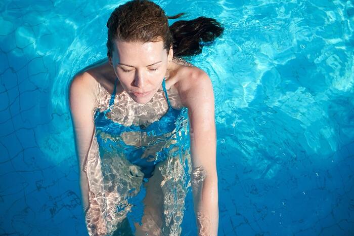 woman in the water wearing swimming suit